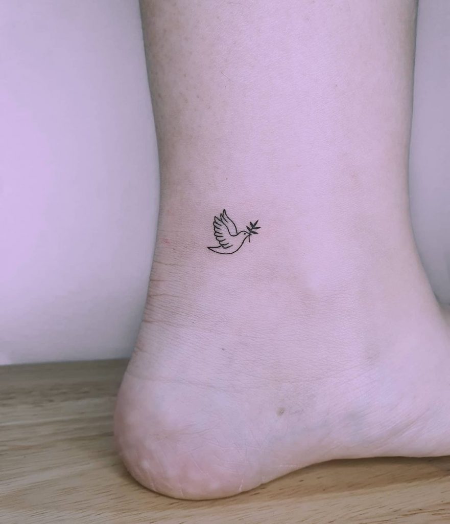 small bird with a leaf tattoo