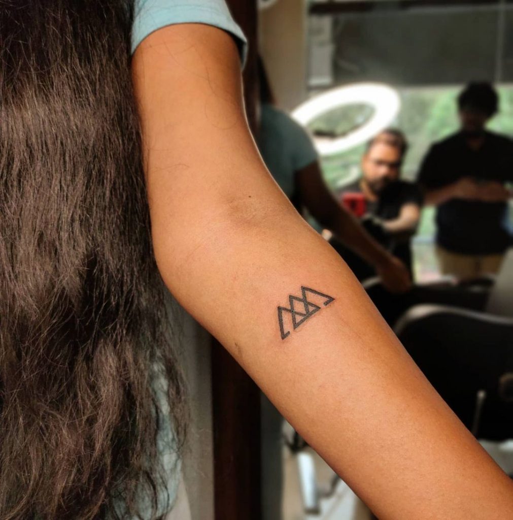 triangle small tattoos with big meanings model