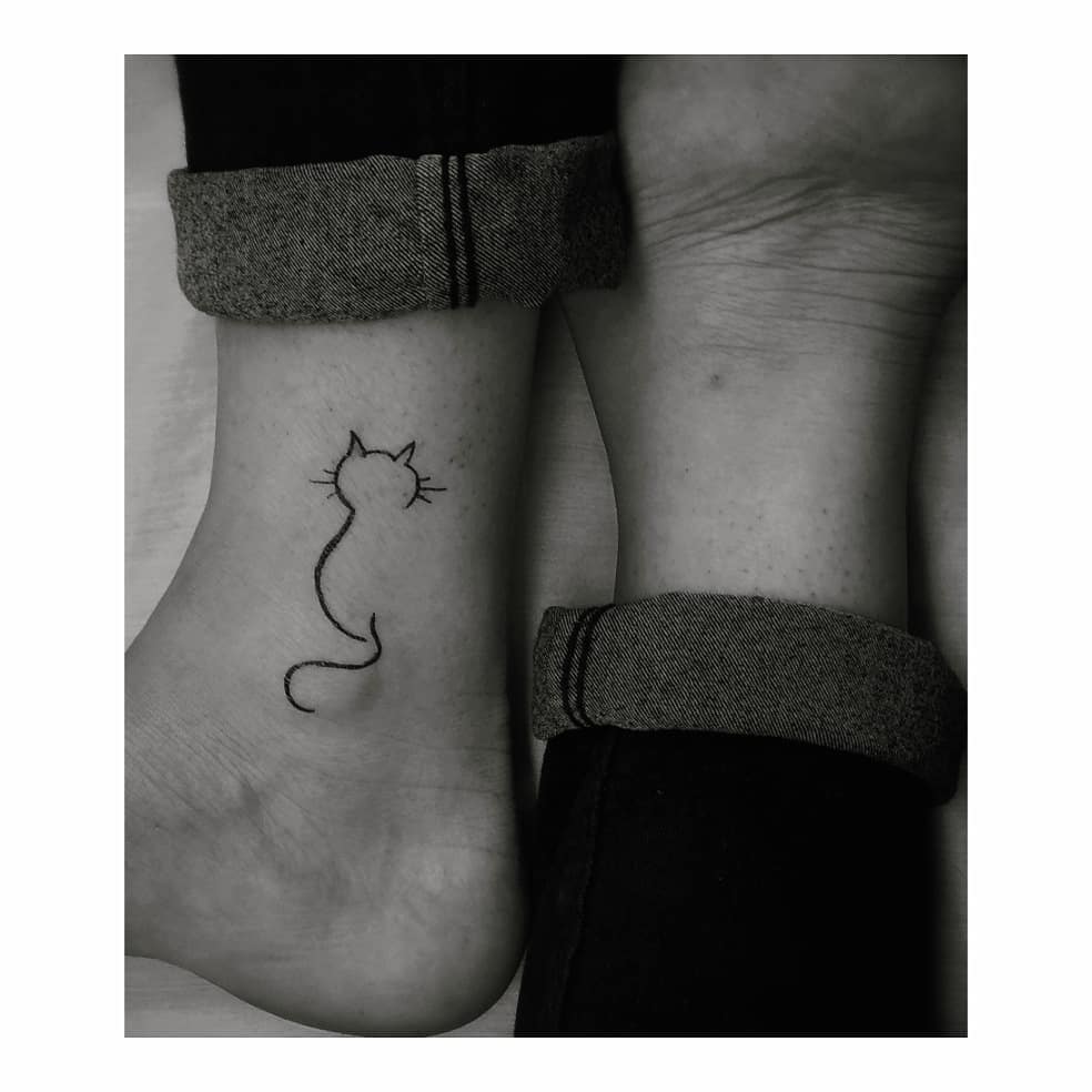 adorable cat small tattoos with big meanings
