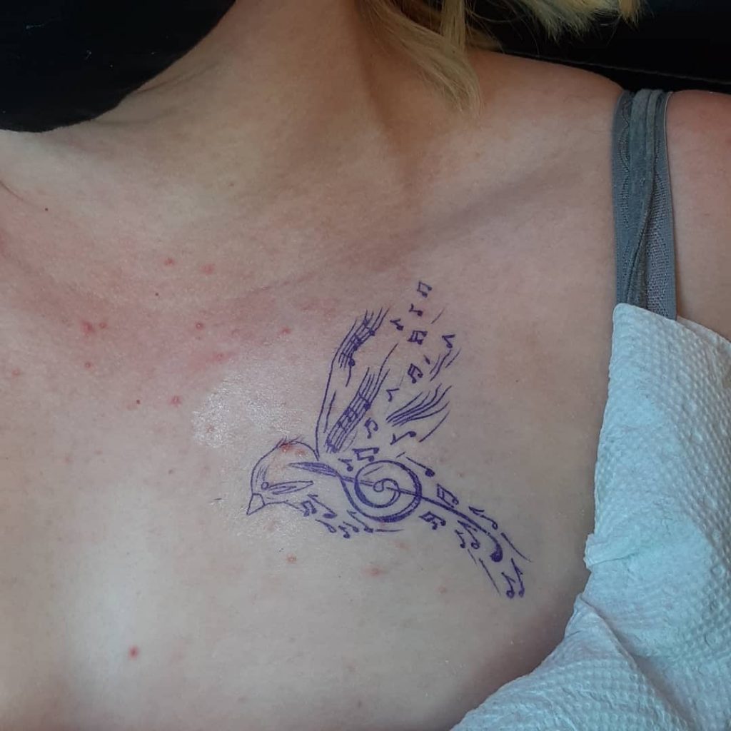 small music bird tattoo