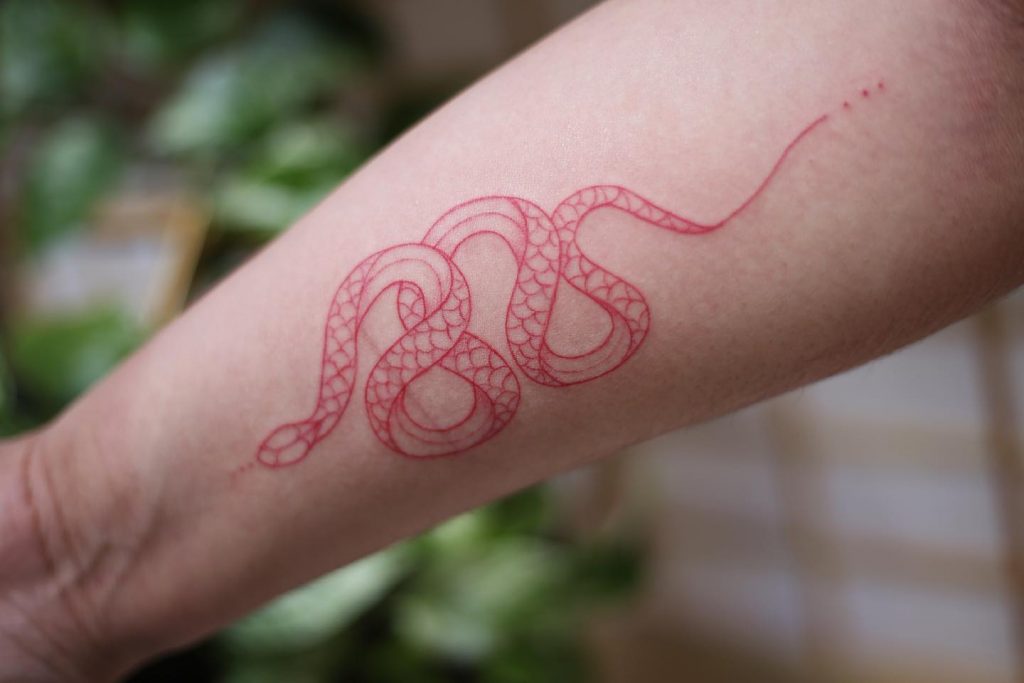 minimal red serpent tattoo