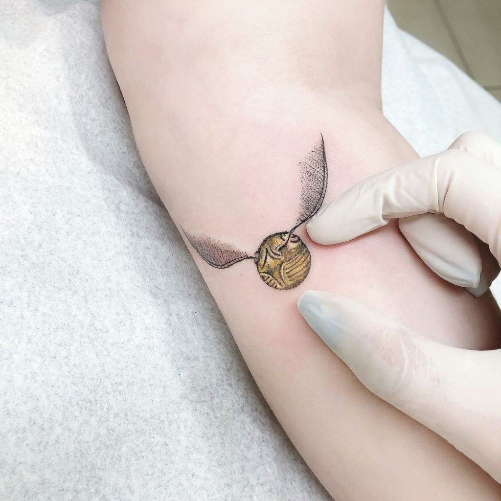 tiny snitch tattoo