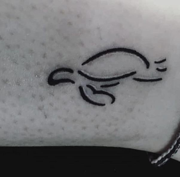 A minimalist turtle tattoo