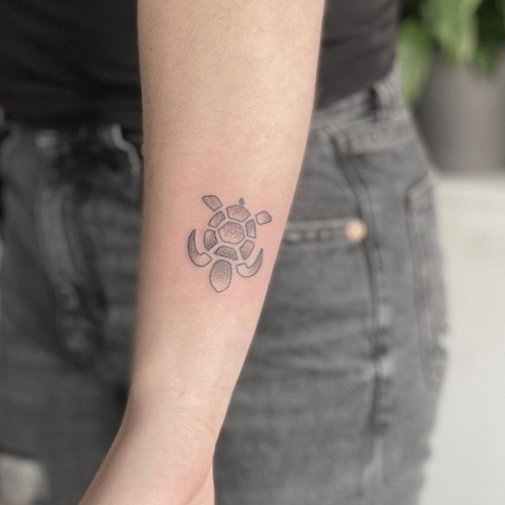 A minimalist turtle tattoo.