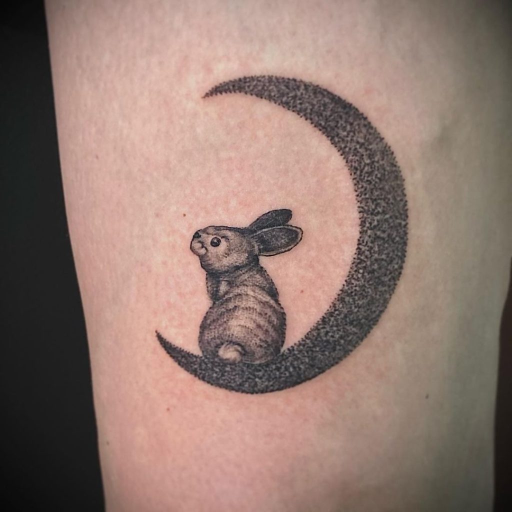 A moon with rabbit tattoo