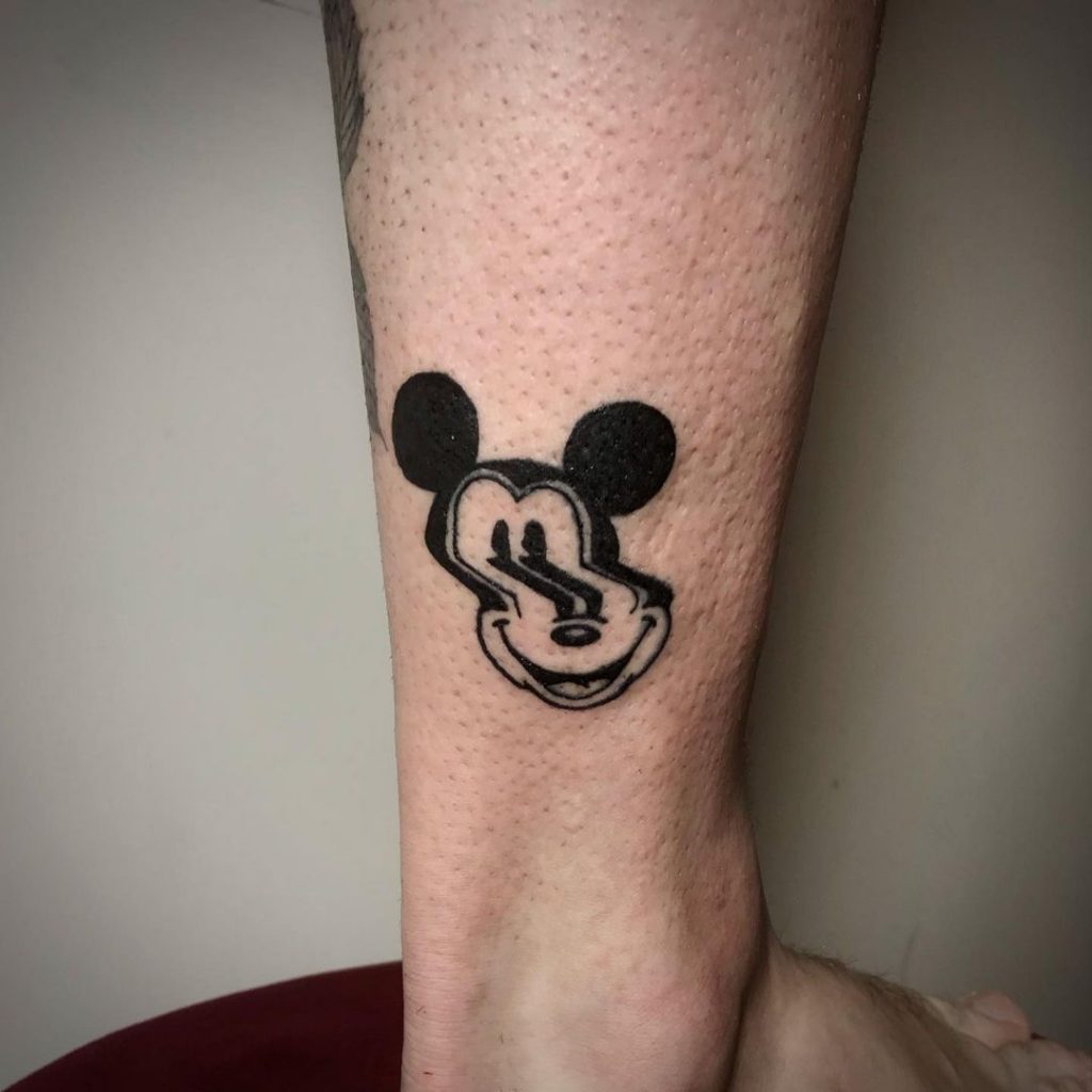 A distorted Micky Mouse tattoo