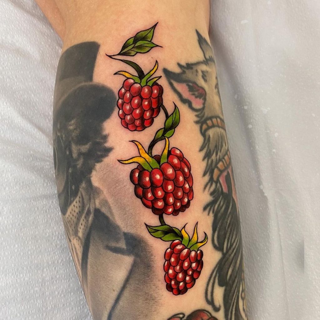 A berry ivy small tattoo design