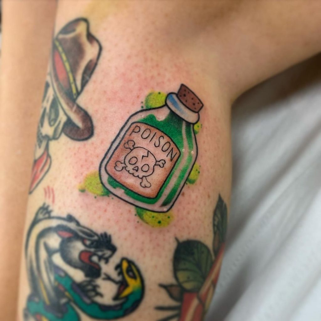 A poison bottle small filler gap tattoo