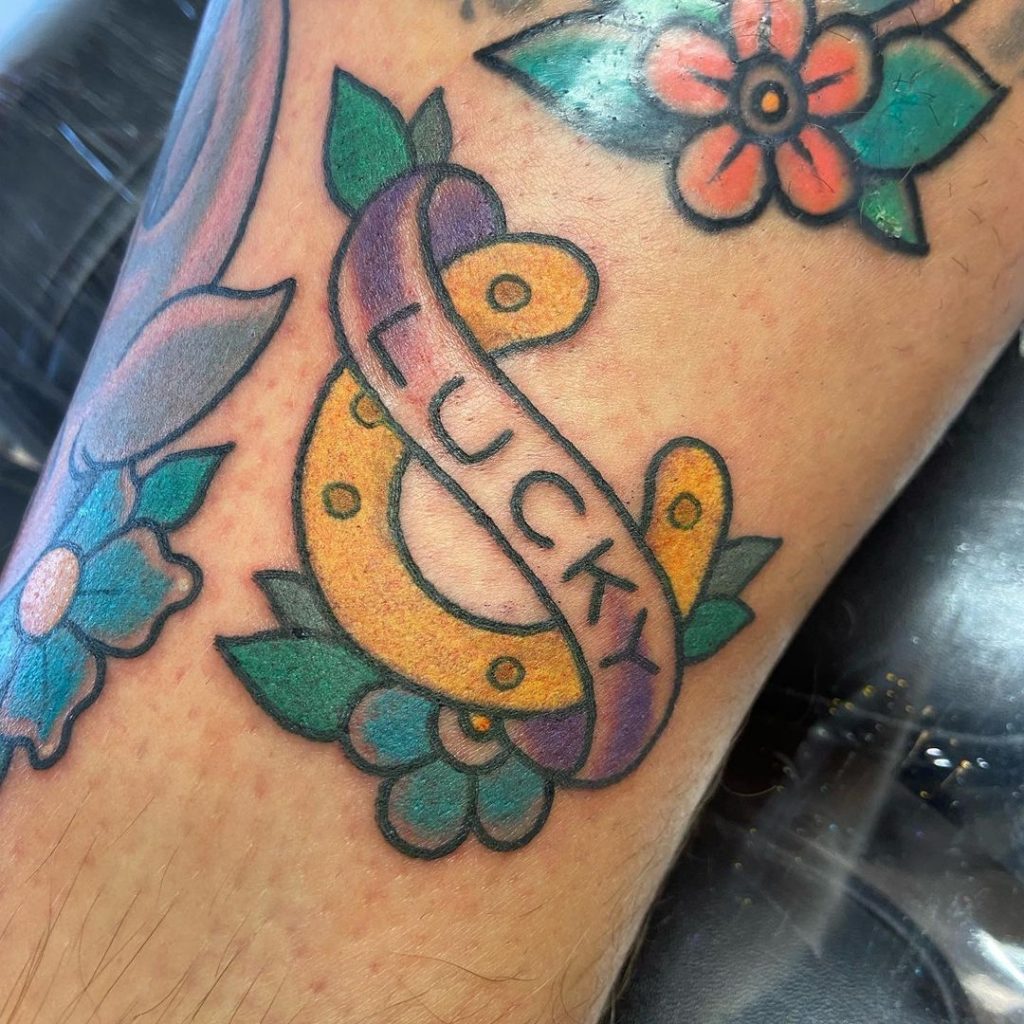 A lucky charm small filler tattoo design