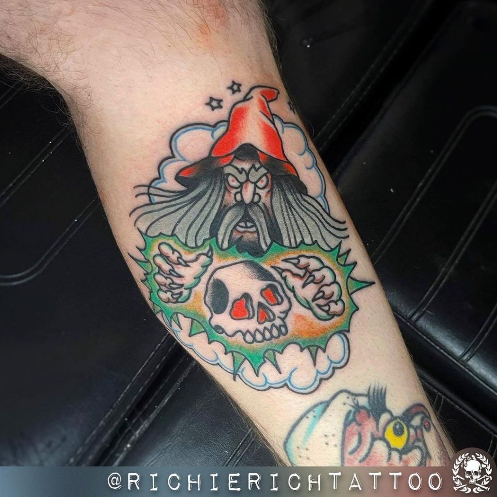 A wizard small skull tattoo idea