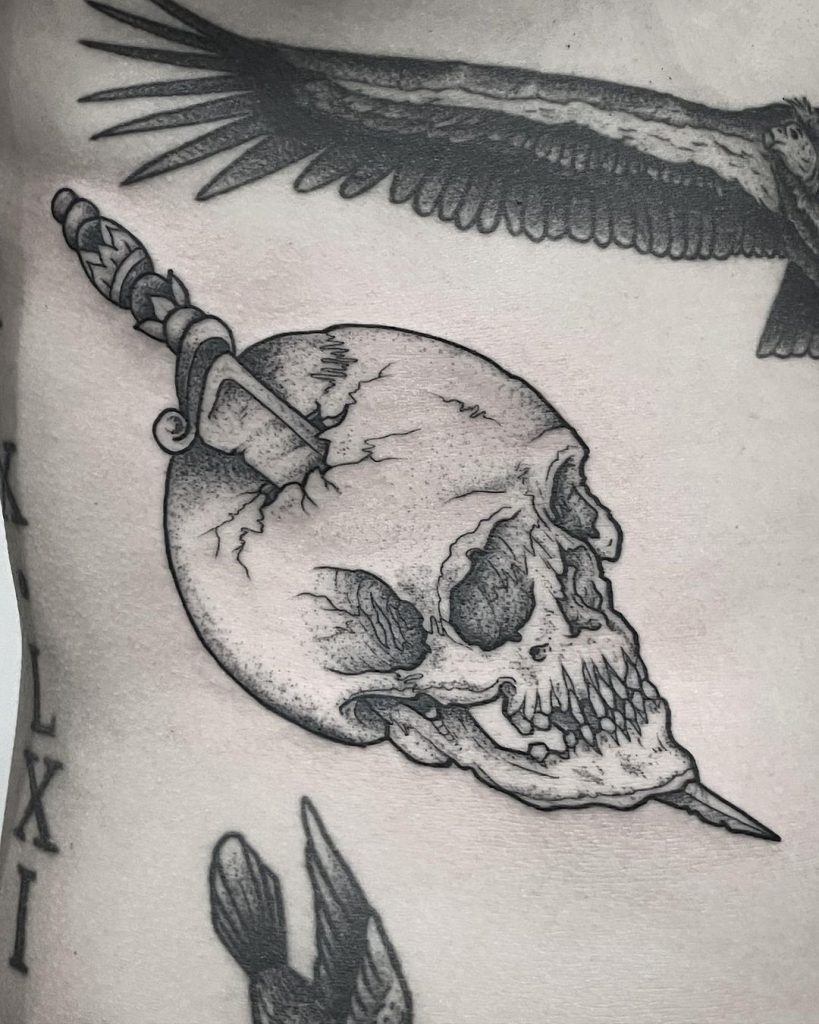 A skull tattoo idea with pointy chin