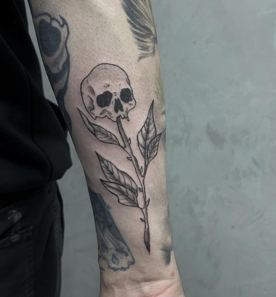 Flowers replaced by small skull tattoos.