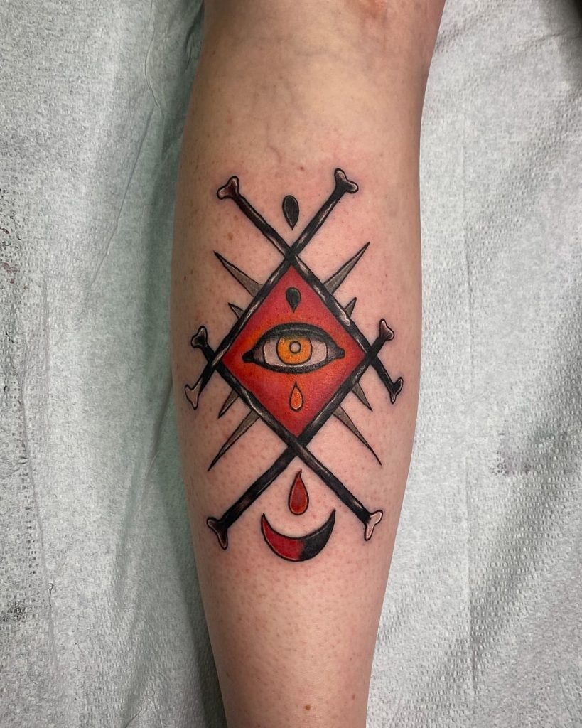 An eye framed with blades small traditional tattoo