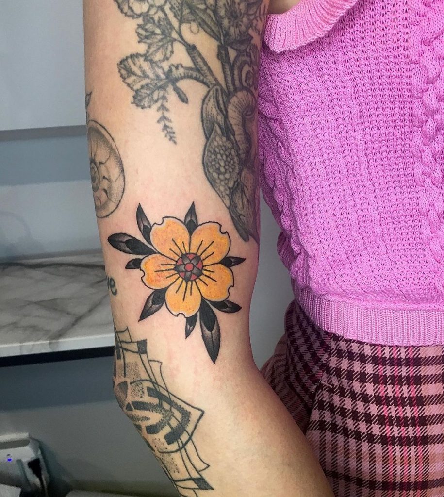 A flower small traditional tattoo