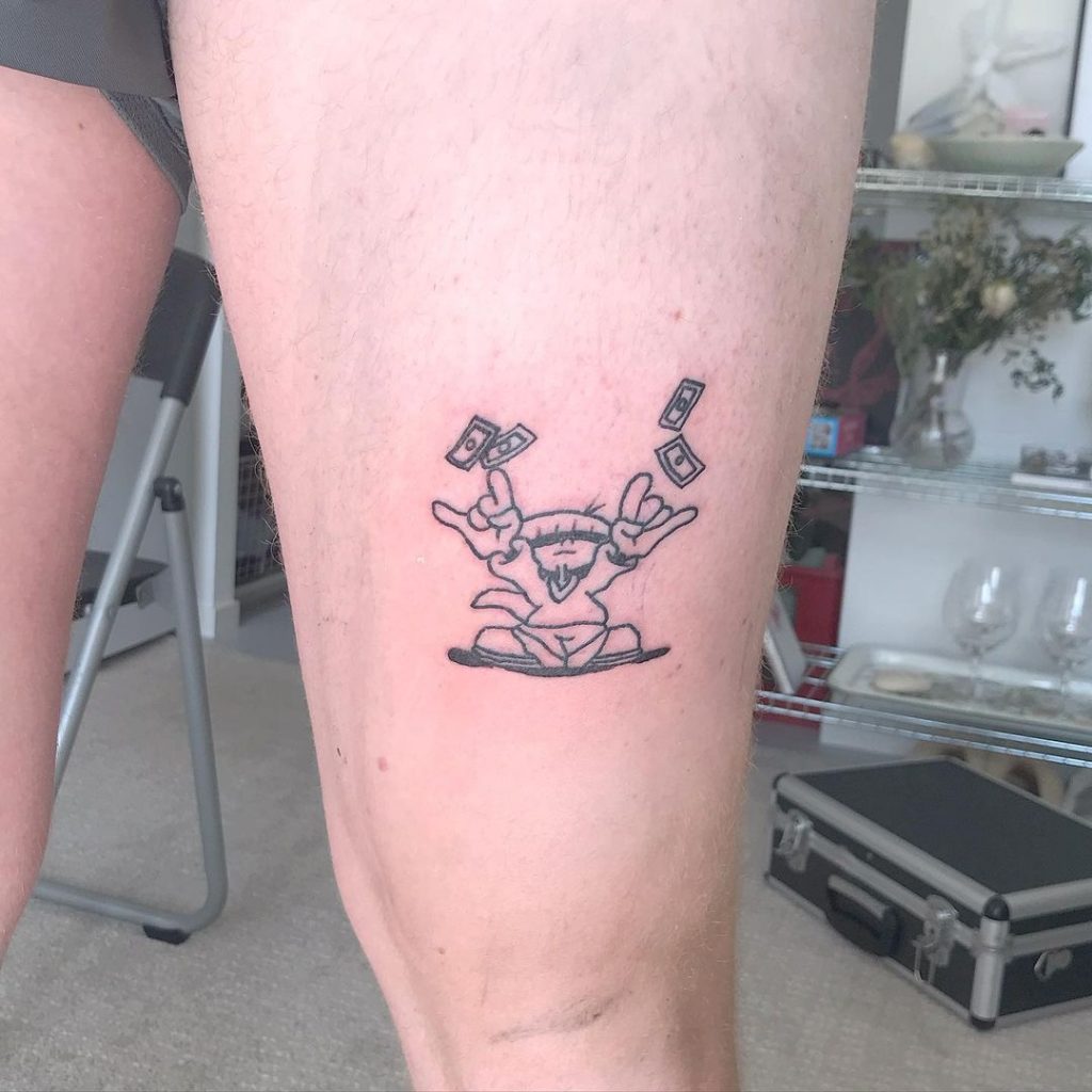 A rock'n roll small leg tattoo for men