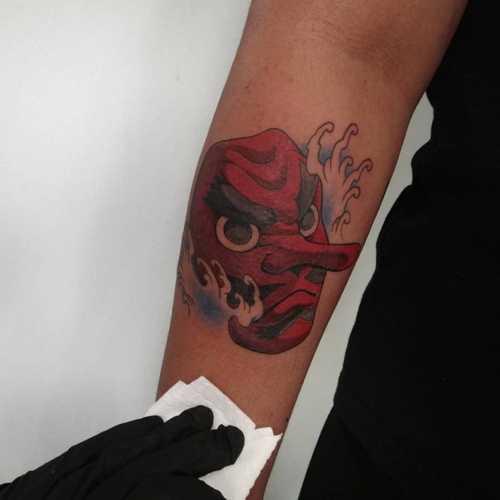 Devil color tattoos on dark skin