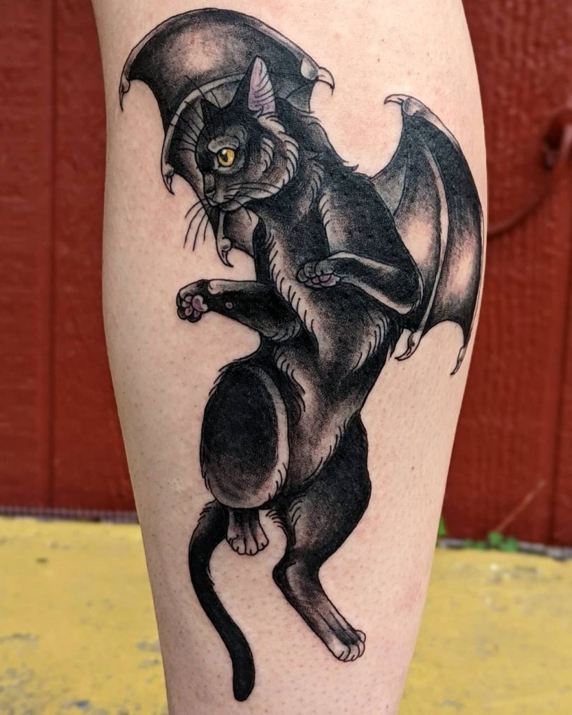 Cat disguised as a Bat black cat tattoo