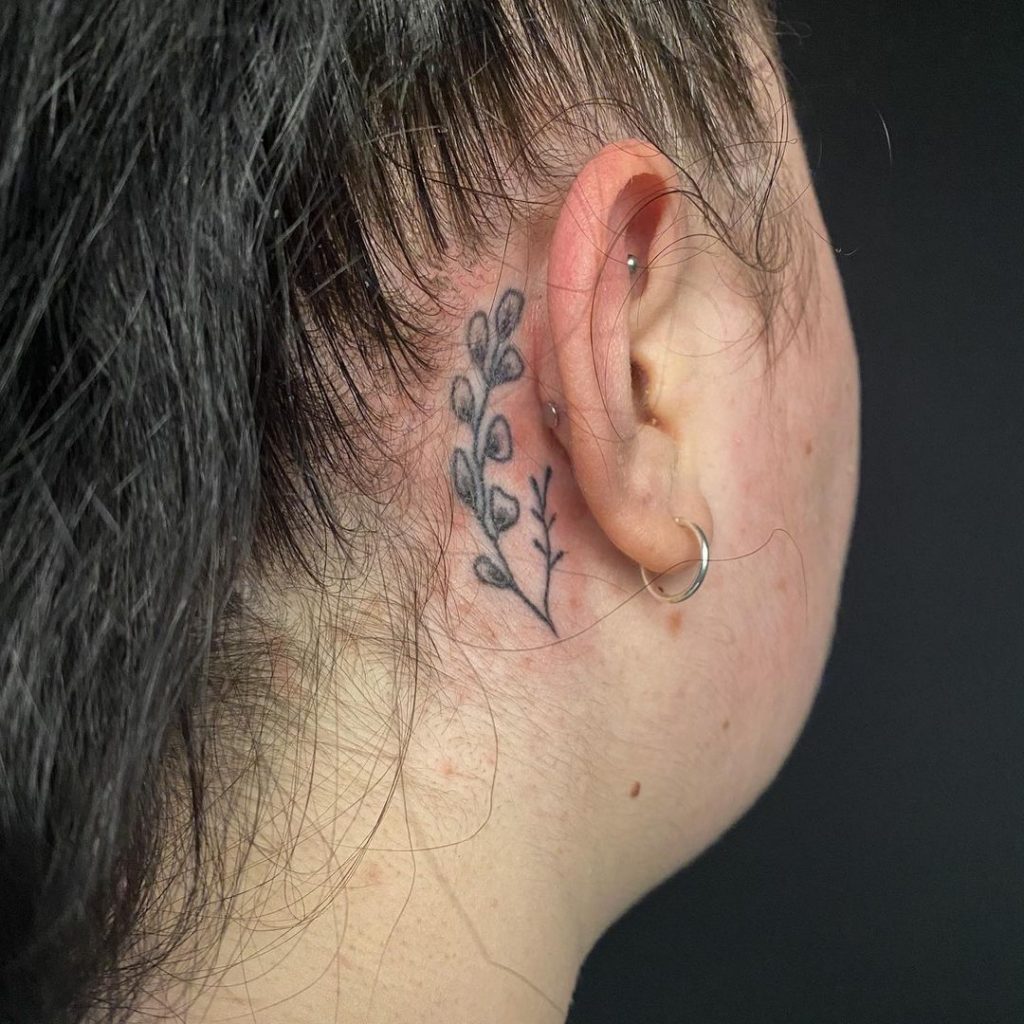 Ivies as behind the ear tattoos