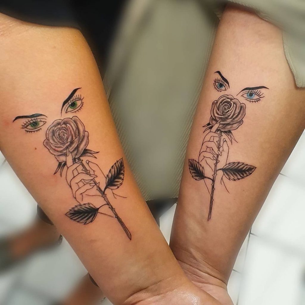 Roses and eyes combination as small friendship tattoos.