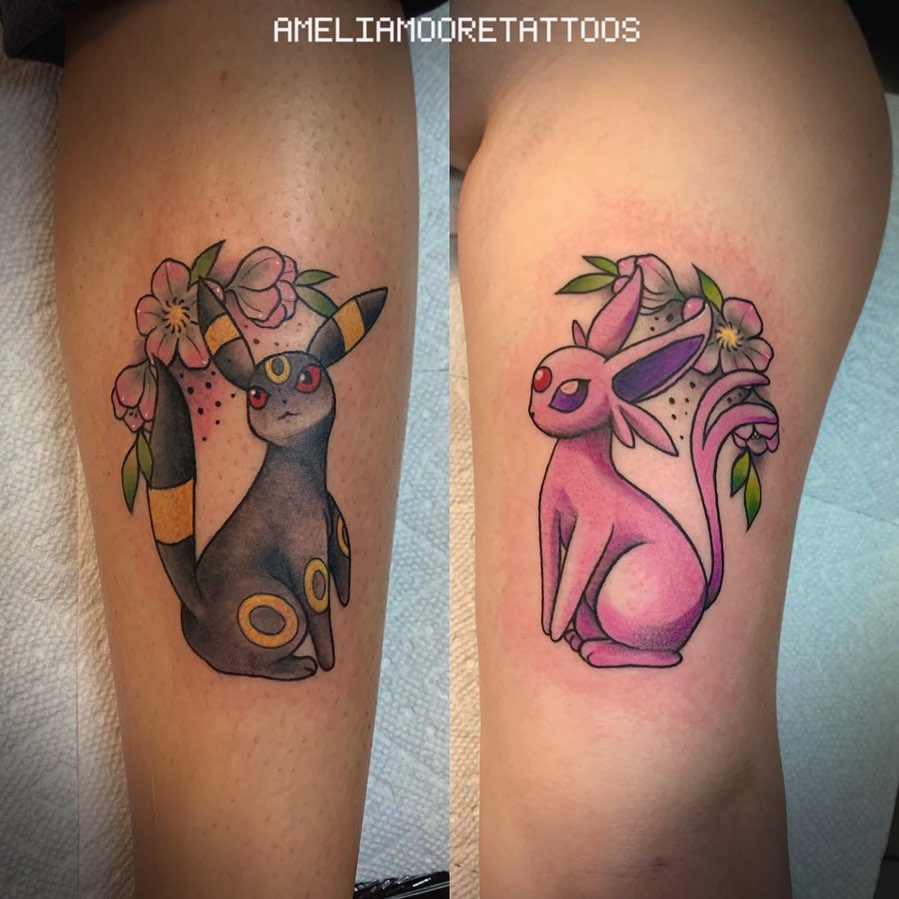 Black and pink cats as small friendship tattoos.