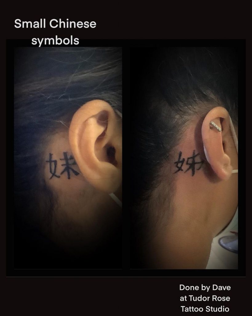 Chinese symbols as behind ear tattoos