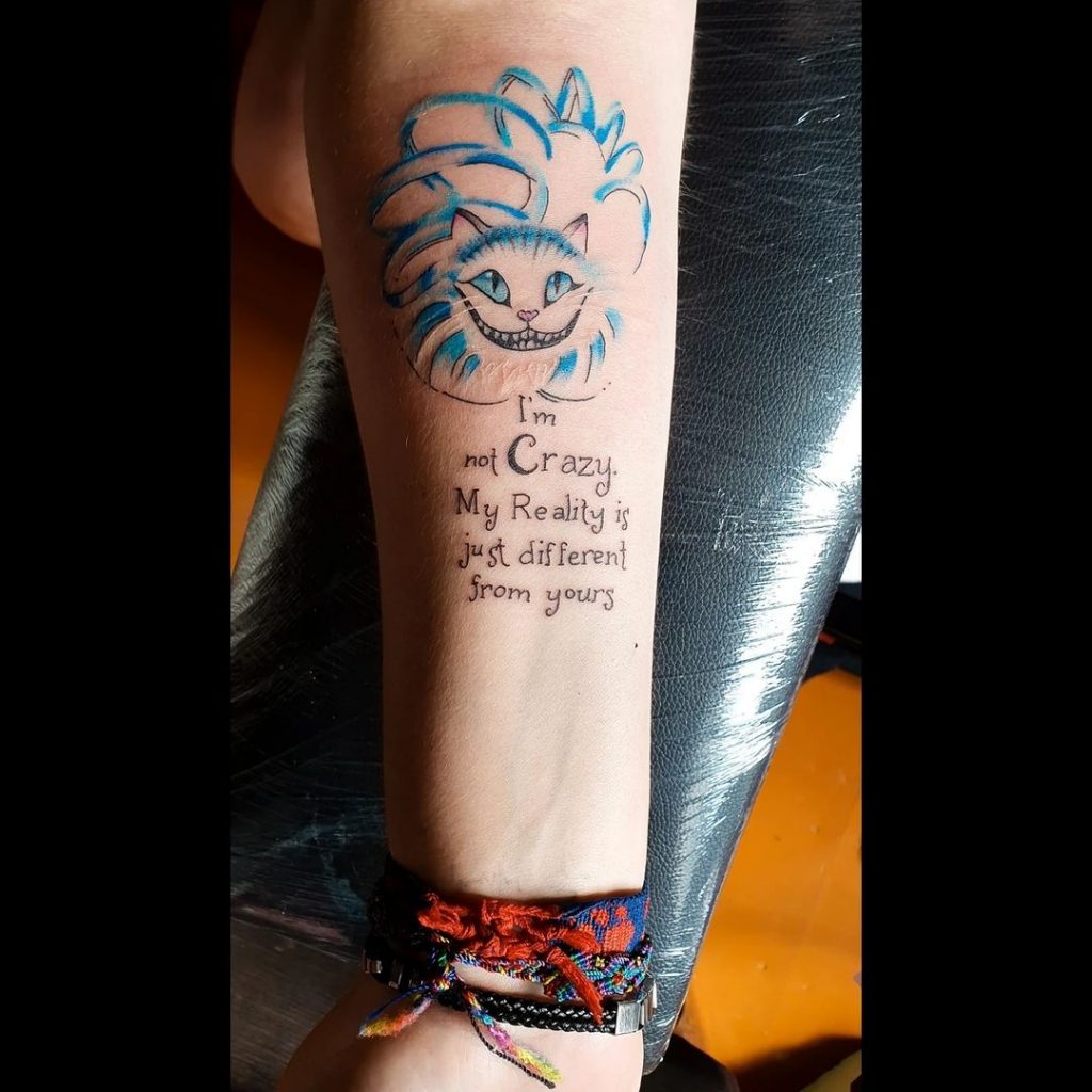 Cheshire cat tattoos with inspiring quotes