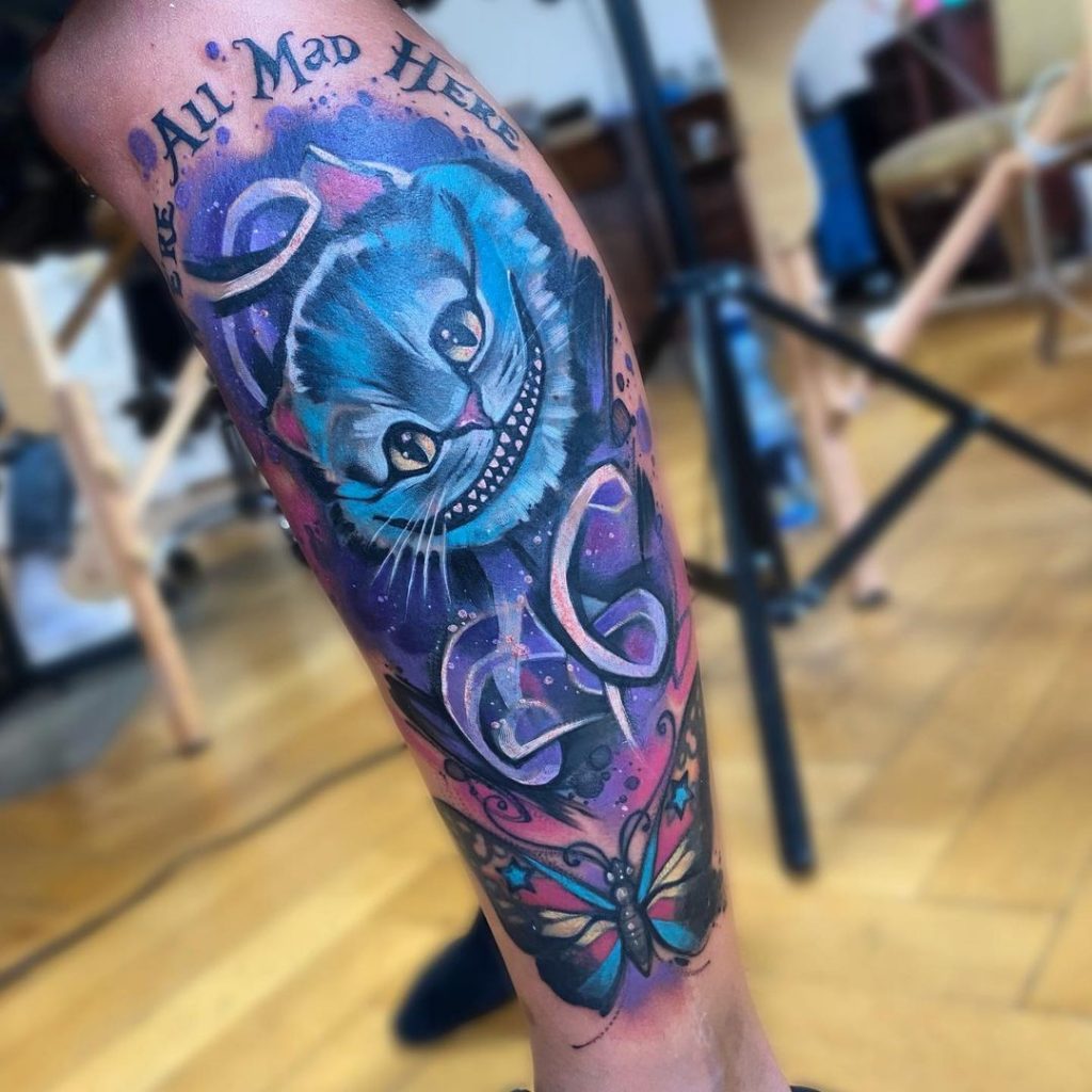 Purple Cheshire cat tattoo